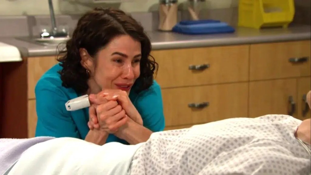 Sarah holds xander's hand in the hospital on days of our lives
